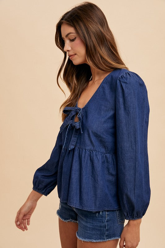 Lyra® | Long sleeve denim top with tie front peplum