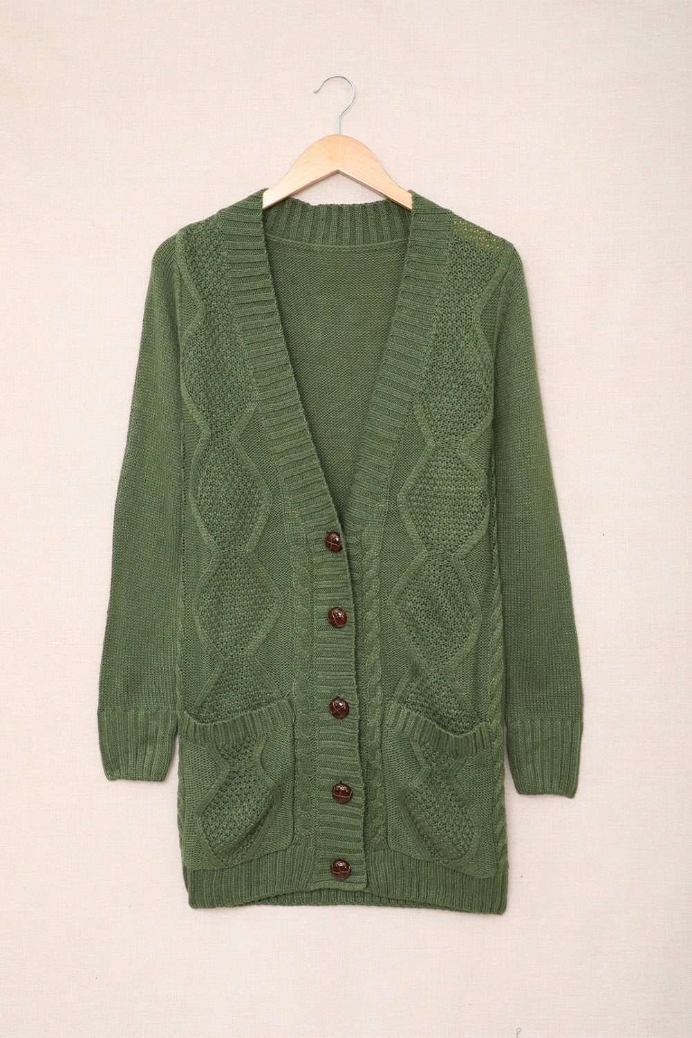 Lyra® | Green cardigan with front pocket and button closure