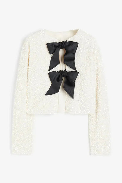 Leslie® | Two ways to celebrate a jacket with a bow and sequins at the front